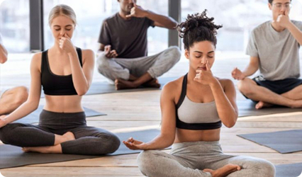 Group practicing guided breathwork